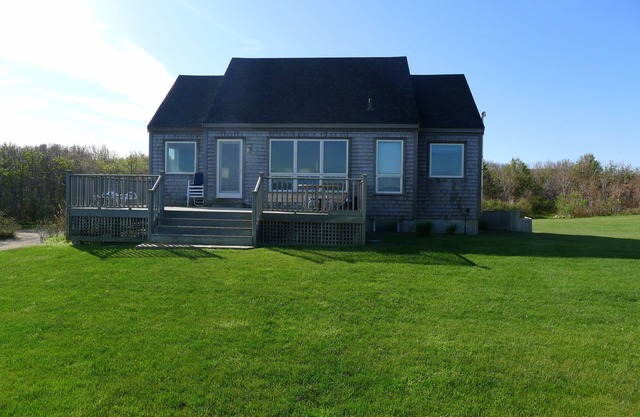 Cachalot cottage on a bluff directly on Wauwinet Harbor