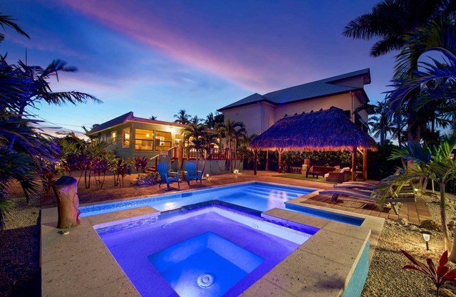 Charming 2-Bed Home with Pool, Tiki Hut, Canal Access, & Steps to Beach & Dining