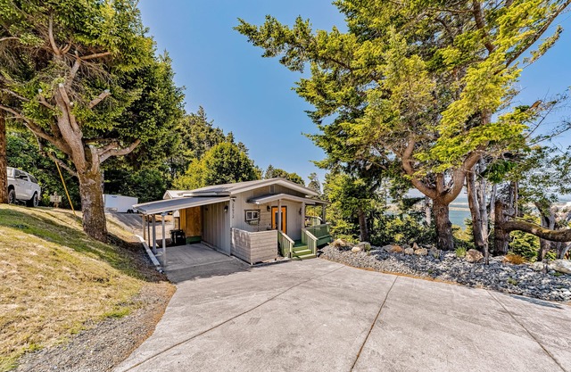 Charming coastal home with water views, large covered deck