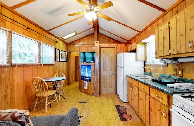 Charming lakefront cabin on two acres with dock & firepit