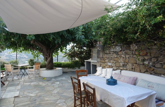 Charming traditional house in a greek island with its garden