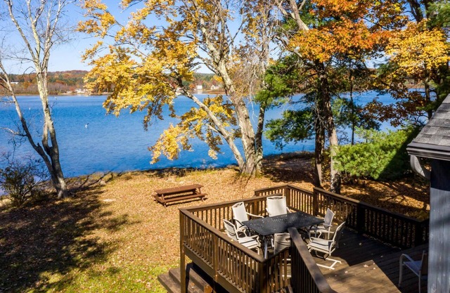 Charming waterfront on Silver Lake home with a sandy beach and wraparound deck
