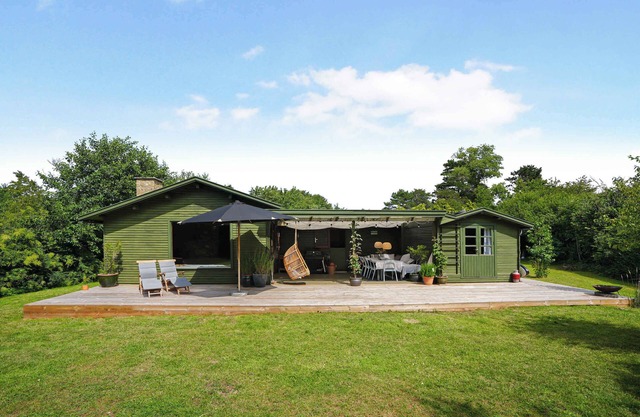Classic danish summerhouse close to ocean, beach and forest