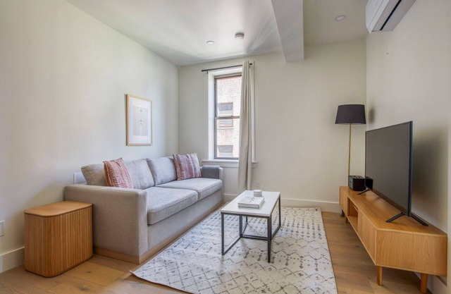 Clean East Village 1BR w/Rooftop Pool, Gym, W/D, A/C, by Blueground