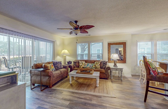 Coastal Condo with golf course view and shared pool access
