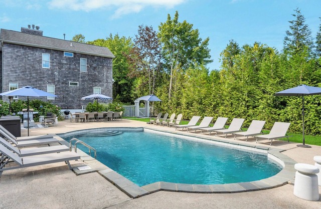 COLONIAL COMPOUND WITH OVERSIZED LIVING ROOMS, GYM, AND ARCADE ROOM, CLOSE.