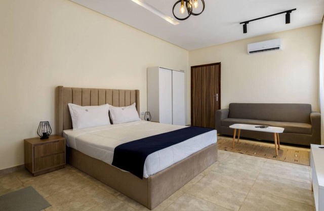 Comfy Studio with Balcony | Queen Bed , Sofa and Kitchenette and shared community garden