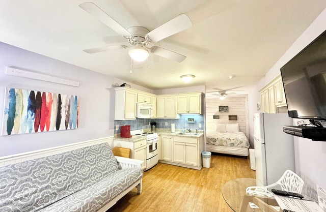 Cozy Beachfront Getaway Studio Kitchen Pool Wifi Steps from the Ocean