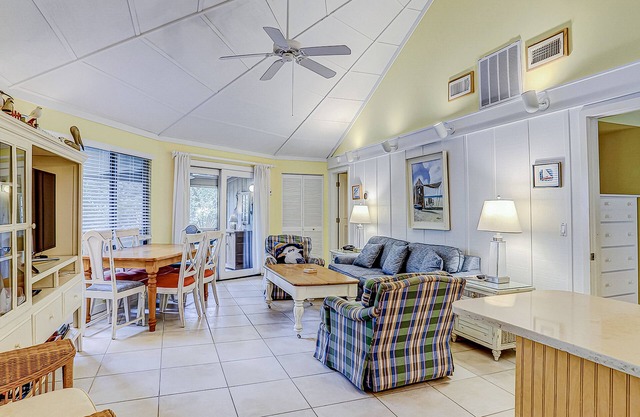 Cozy bungalow offers privacy, shared pool, and beach access via dedicated trail