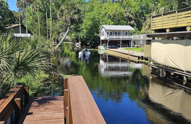 Cozy canal front house with its own boat ramp and dock. Amazing waterfront view.