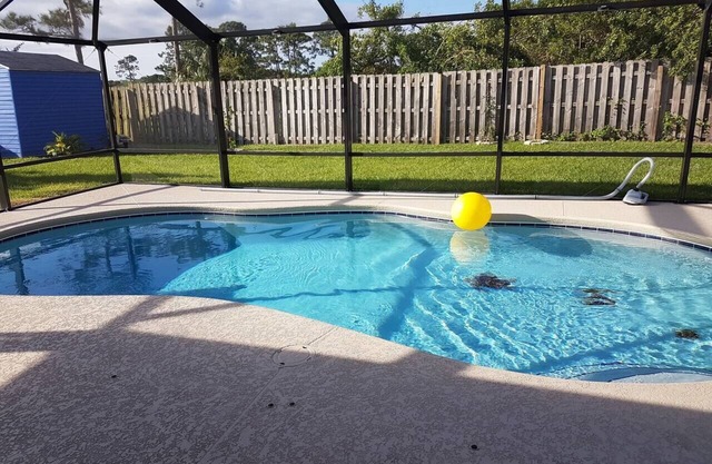 Cozy Port St Lucie getaway. Lanai Plus Private Heated Pool & Private Gardens