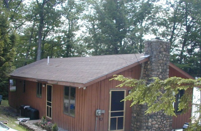 Cozy waterfront cottage on private land with beautiful sunsets over Long Lake