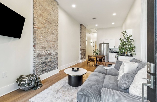 Cozy with exposed brick and studio layout all essentials for comfortable stay.