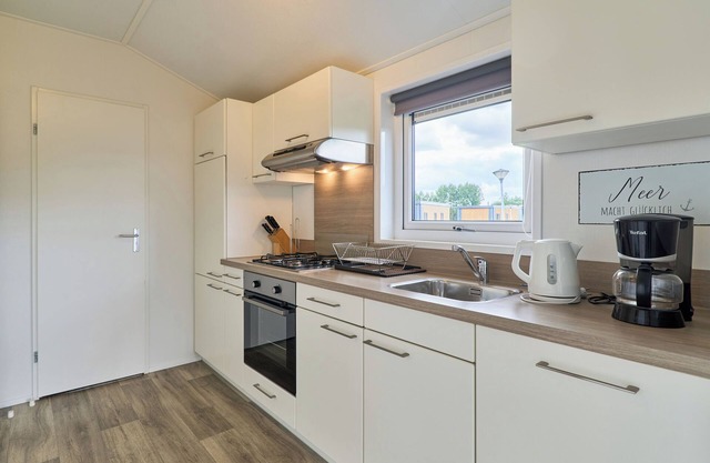 Detached vacation home Wellenkönig in Süsel with terrace by the lake and WLAN
