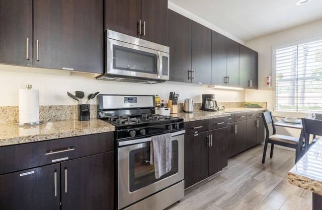 Discover comfort and convenience in this spacious 3-bedroom, 2.5-bathroom townhouse with king-sized beds, high-speed internet, a 2-car garage, and a prime central location.