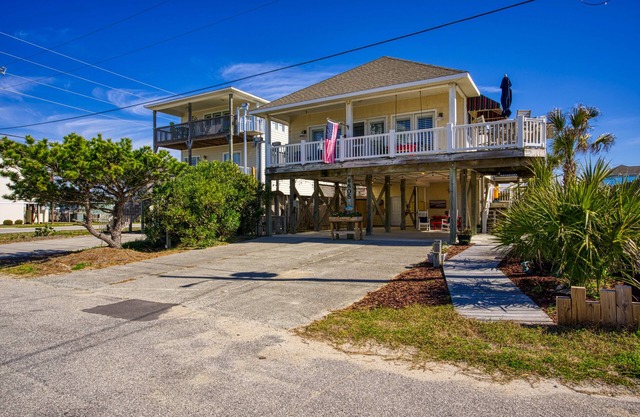 Dog-friendly beach-view home w/wraparound deck, screened porch and fenced yard