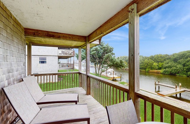 Dog-friendly, canal-front house with dock, balcony, deck, & central AC