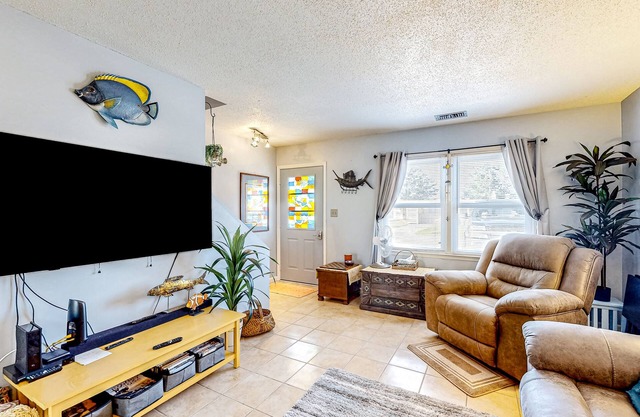Dog-friendly coastal retreat with games, W/D, & patio - walk to the beach