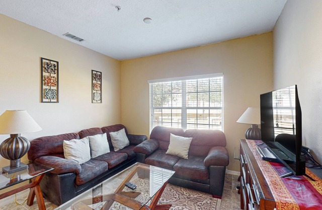 Dog-friendly condo with pool, gym, tennis, & game room - close to parks