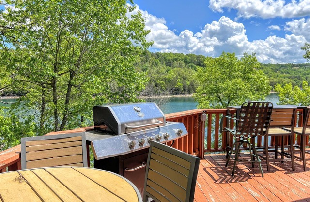 Dog-friendly home with serene views of Beaver Lake, 2 living areas & bunk room
