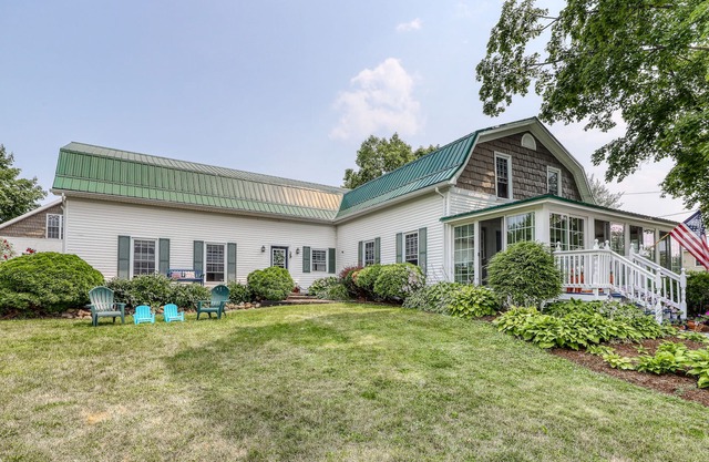 Dog-friendly lake home with private beach, dock, firepit, barn, & treehouse