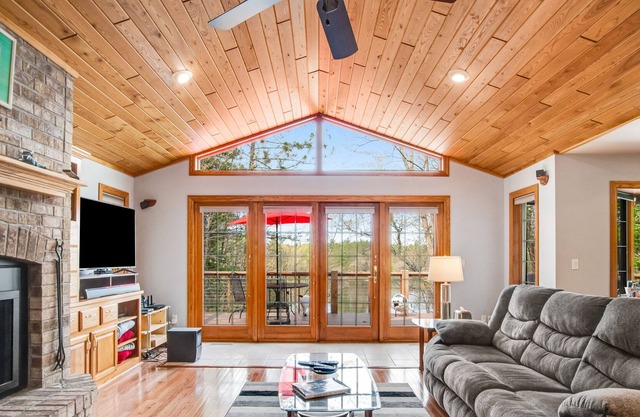 Dog-friendly lakefront home with deck, lake views, grill, fireplace, patio, AC