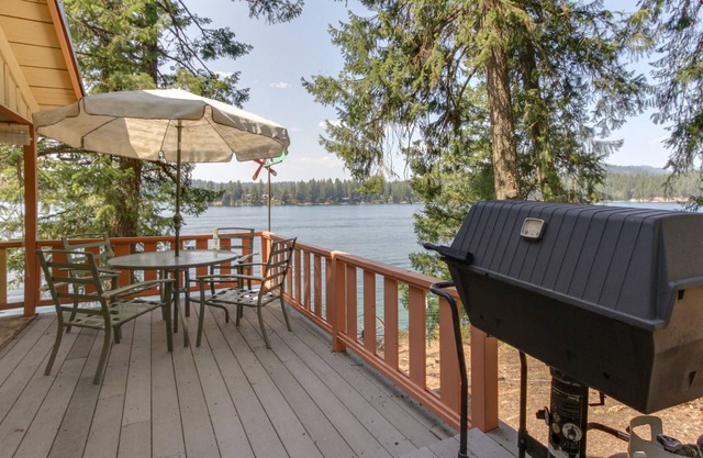 Dog-friendly lakefront cabin with water-view deck, gas grill, & private dock