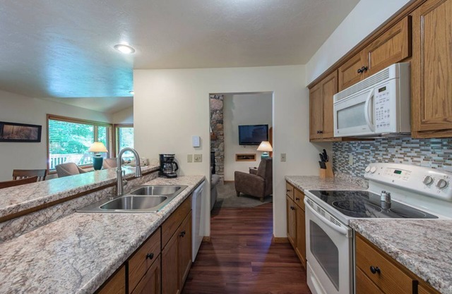 Elegant 2BR Condo with Lake View, Balcony, and Fireplace