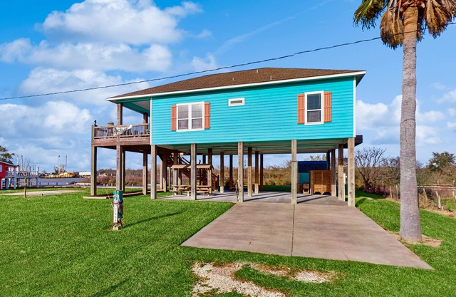 Elegant canal-front home with dock, firepit, deck & kayaks - close to beach