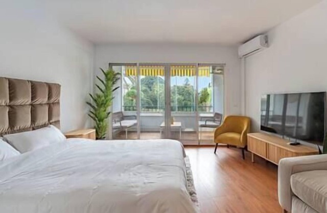 Elegant Studio with Balcony, Pool & Parking