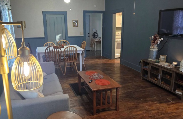 Enchanted Cottage, located in Herington, KS with 1.5 bedrooms and a shaded yard