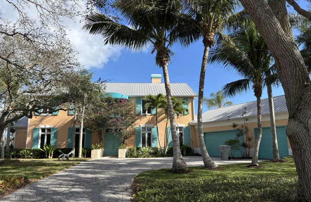 Enjoy our waterfront home with private beach access & boat dock in The Moorings!
