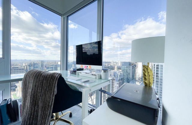 Enjoy panoramic city views from this stylish apartment near Dundas Square