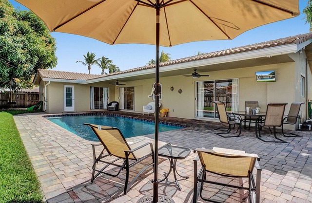 Entire house with heated pool and great backyard 1.5 miles from beach.
