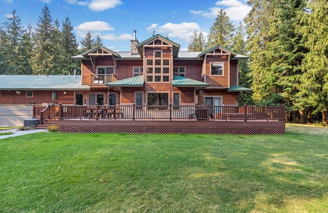 Expansive Riverfront Lodge with Dock, Game Room, Bar & Spacious Deck!
