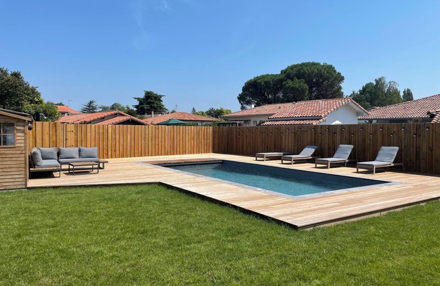Family home with heated pool ideally located between village and lake