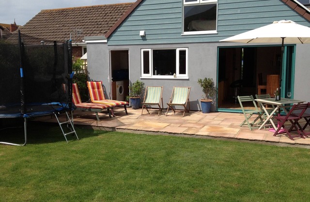fantastic family home- central village location & short level walk to beach