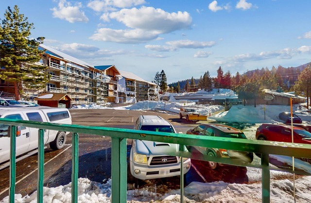 First-floor ski condo with balcony views, pool, hot tub, & fireplace, sleeps 4