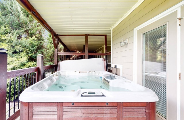 Grand mountain-view retreat with hot tub, 2 living areas, foosball, fireplace