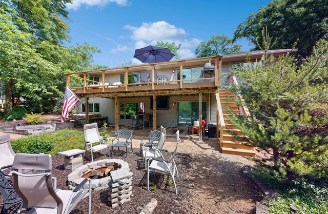 Green side smart home with golf, beach/lake access, off-site dock & EV charger