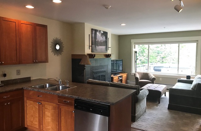 High End 3 bed 3 bath ski in/out condo with private hot tub on the back deck!