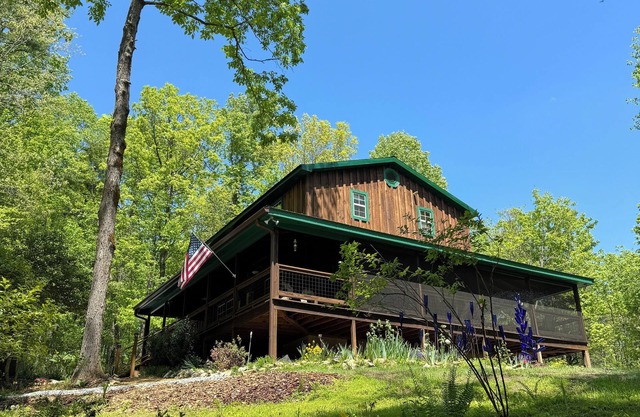 Hilltop Retreat-adjoining Lake home sleeps 8, hot tub and peaceful wilderness
