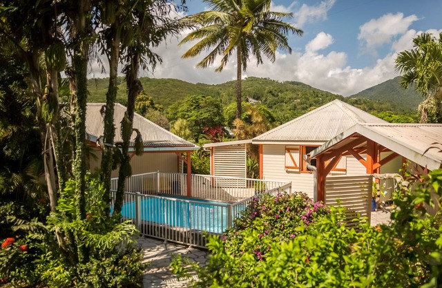 Holiday house with pool in a tropical garden, beach at walking distance