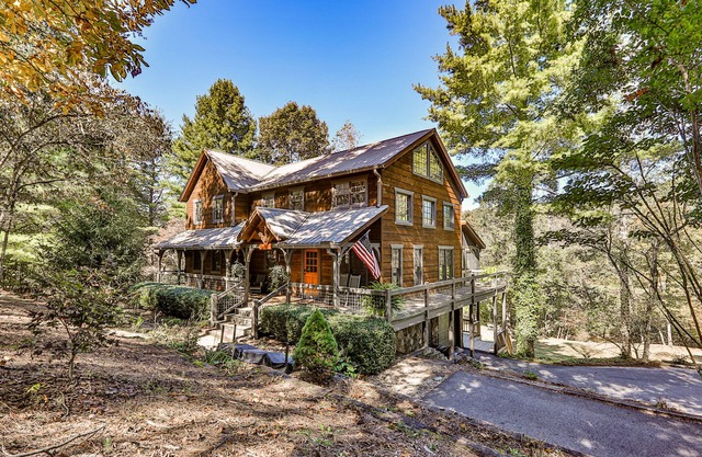 Homey riverfront cabin with hot tub, grill, wood fireplace, AC, & scenic views