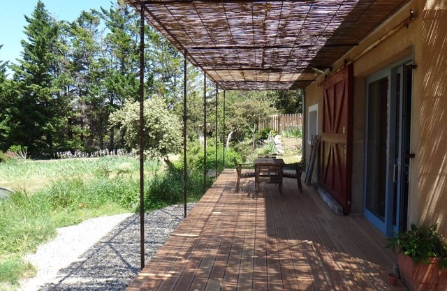 House surrounded by nature, with swimming pool
