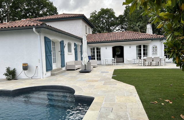 In a green setting, very nice house .