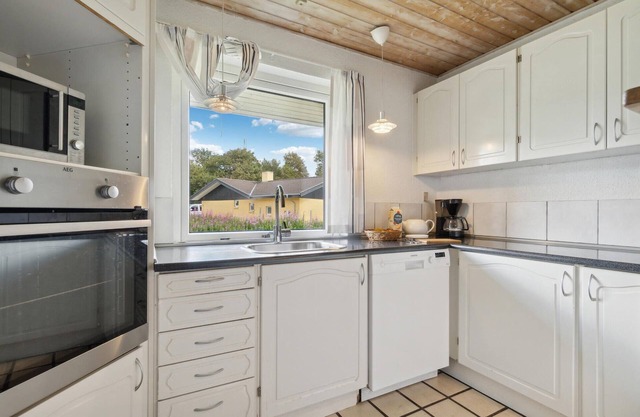 In the vacation village Jegum welcomes you this large vacation home with pool.