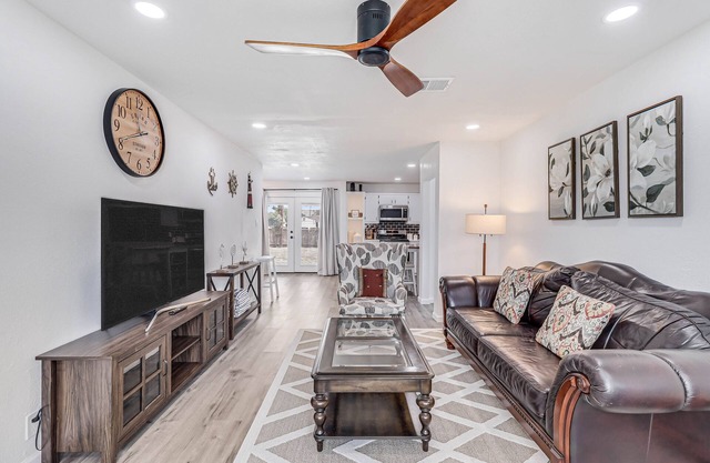 Inviting house with large enclosed yard, central AC, washer/dryer, & golf nearby