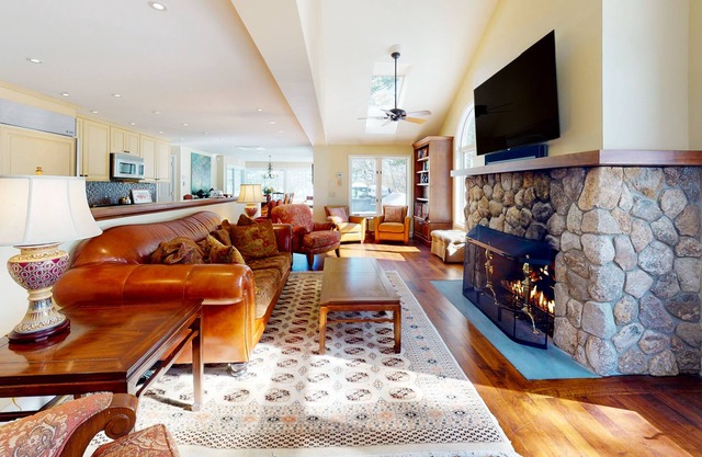 Inviting lakefront home with firepit, hot tub, skiing, golf nearby, & W/D