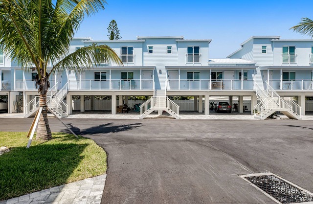 Inviting oceanfront condo with pool, dock, balcony, & W/D
